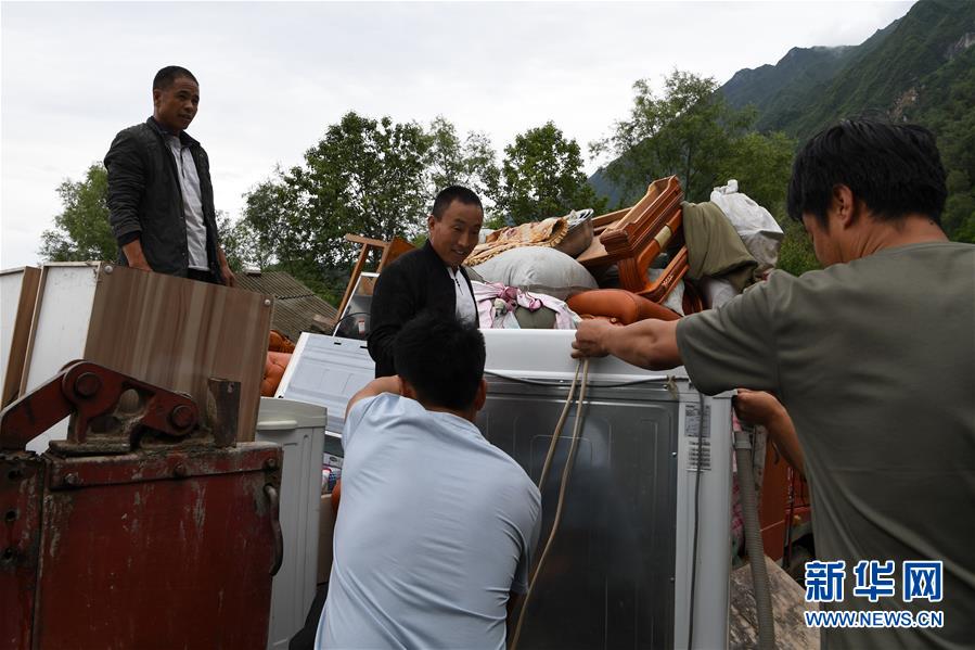 （新華全媒+）（9）千里“挪窩”，踏實開啟新生活